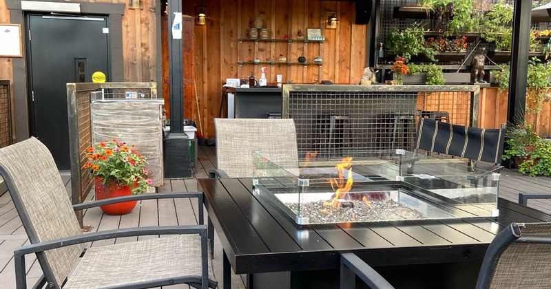 Exterior, patio, a fire pit table, chairs