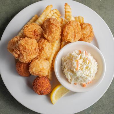 Fried sea scallops served with hushpuppies, coleslaw, and french fries