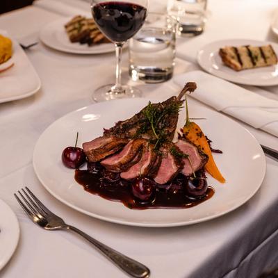 Served roasted duck and wine.