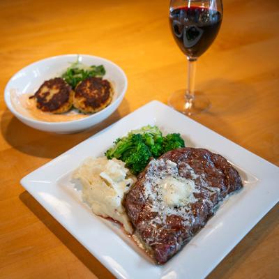 Grilled Ribeye with Gorgonzola Butter and red wine.