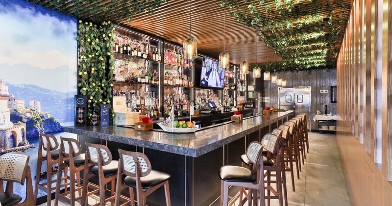 Bar area, neatly lined up bar stools