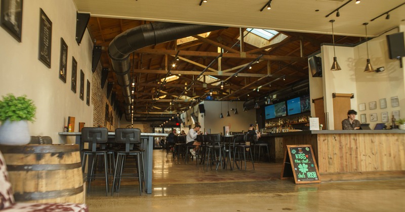 Interior, seating area with few guests in the back