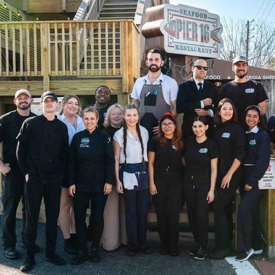 Staff posing outside for a group shot.