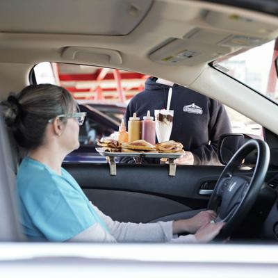 customer in car receiving food.