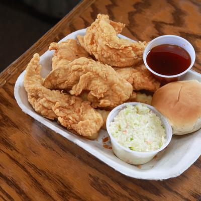 Fried chicken, bread, coleslaw, and dip.
