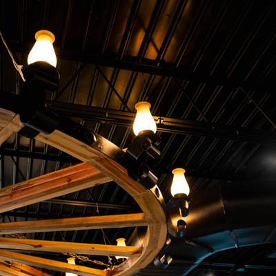 Vintage-style lamps with glowing bulbs providing ambient lighting.