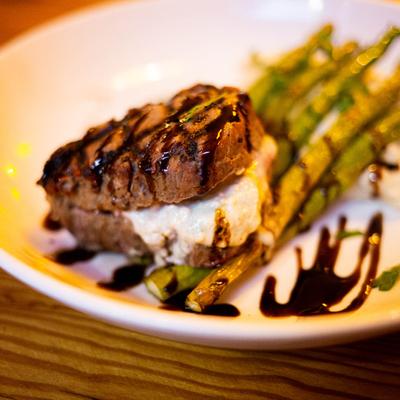 Grilled Filet Mignon stuffed with Gorgonzola, served with mashed potatoes and grilled asparagus