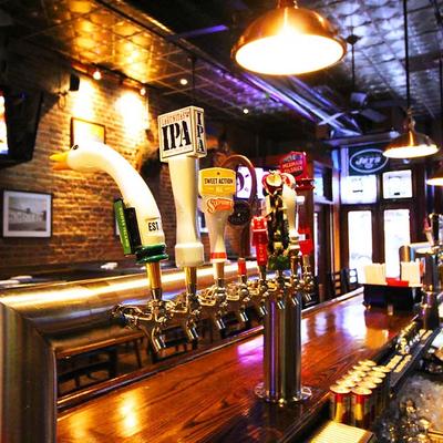 Bar area featuring beer taps.