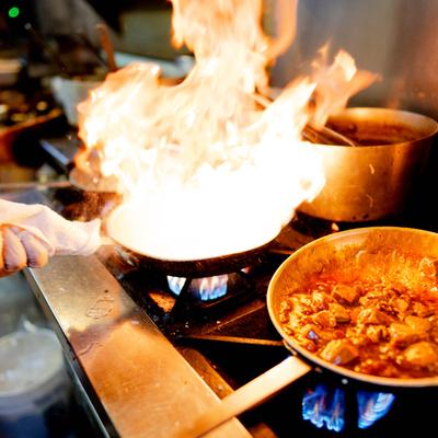 Flambe food cooking.