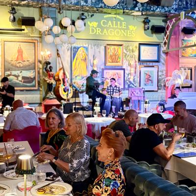Guests eating at the tables while the band plays.