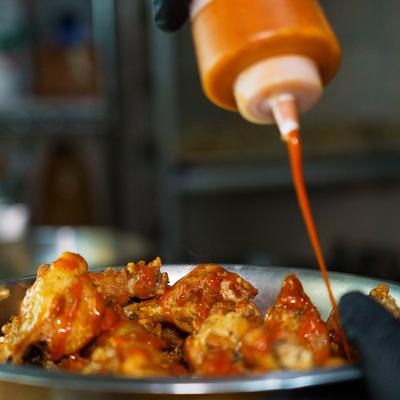 Chicken wings with hot sauce.