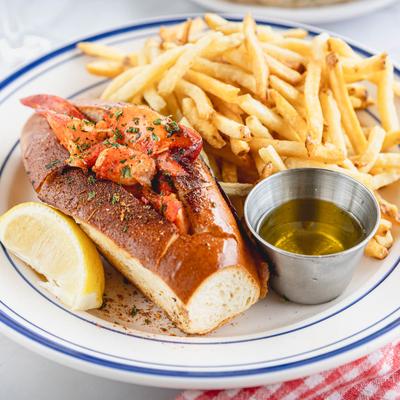 Lobster Roll, with fries, and melted butter.