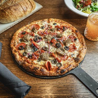 Godfather pizza on the table.