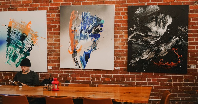 Interior, guest tables and chairs, wall art