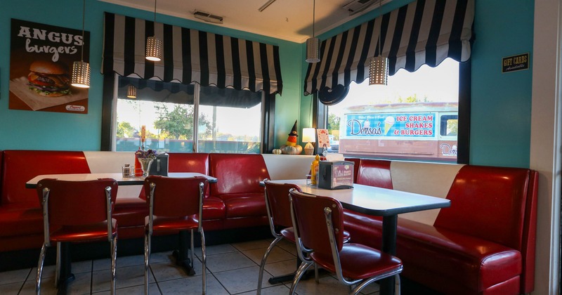 Interior seating area with tables, chairs and booths
