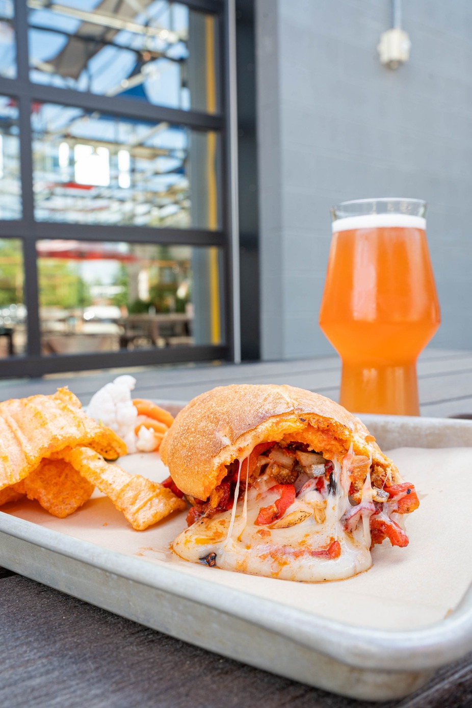 Meatball Stuffed Hoagie - Meatballs, cheese, tomato sauce, peppers, and onions stuffed into a house made hoagie roll