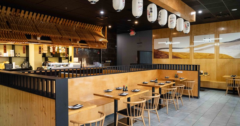 Inside, dining tables ready for guests, chairs