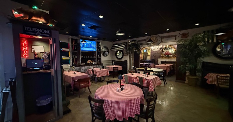 Dining room's interior with vintage telephone booth, tables and chairs