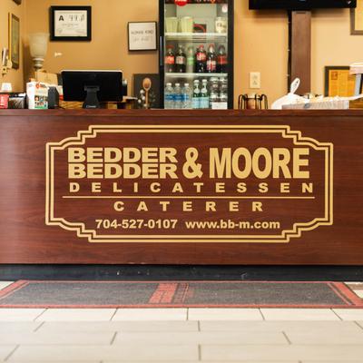 The restaurant's name on the large hardwood counter.