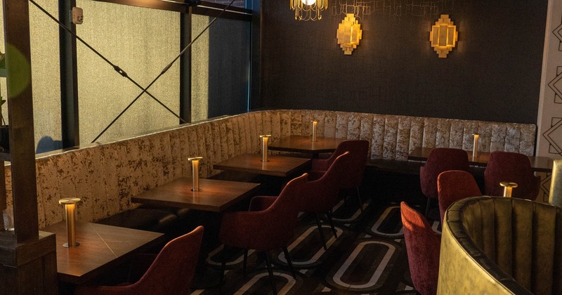 Interior, dining area, vintage leather banquette bench with tables and chairs