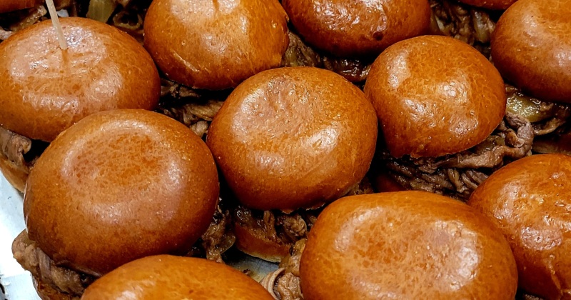 A tray of pulled pork sandwiches