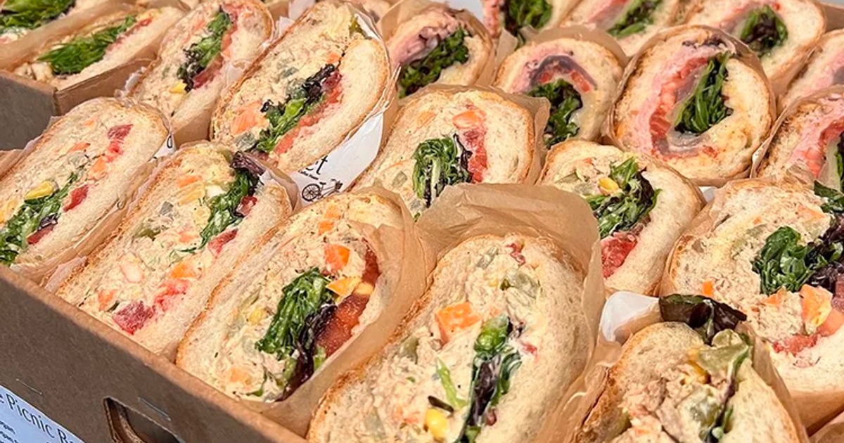 Catering platter with various sandwiches packed in a box