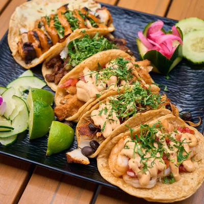 Taco platter with assorted tacos.
