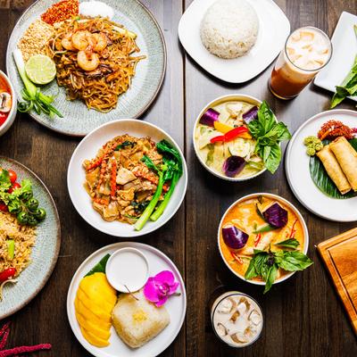 Table spread with different dishes, overhead view.