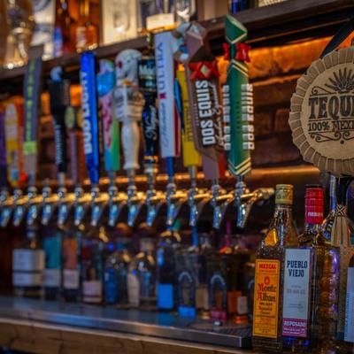 Draft beer taps with colorful labels.