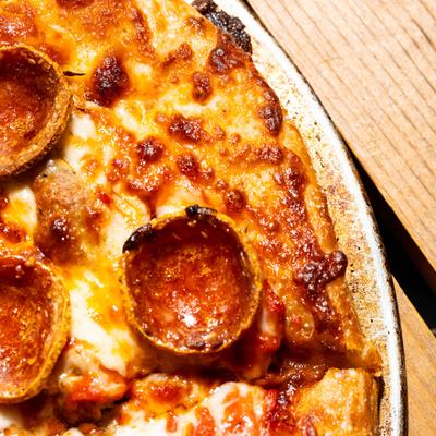 Pepperoni and sausage pizza, closeup.