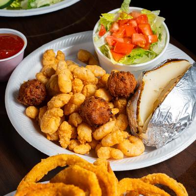 Calabash Shrimp with hush puppies, salad, and a baked potato.