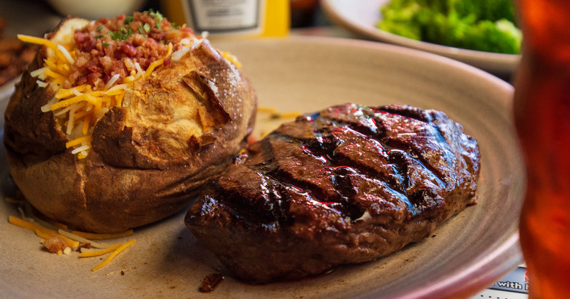 Marinated and grilled sirloin steak, served with loaded baked potato