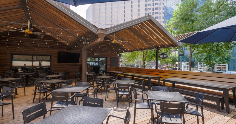 Patio, long banquette seating, tables, chairs