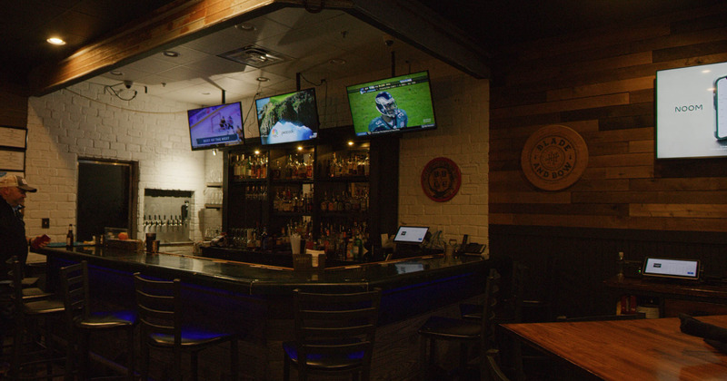 Interior, bar area with games playing on TVs