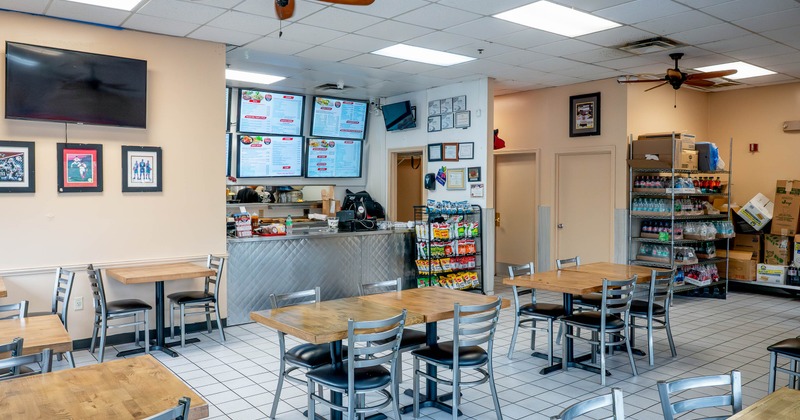 Interior, tables and chairs in seating area