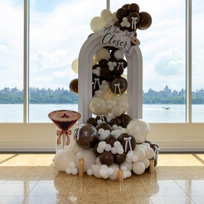 White and brown balloon display.