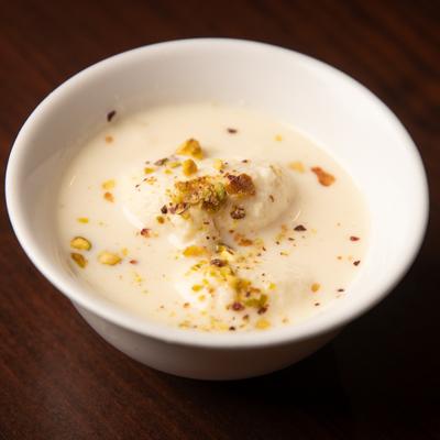 Indian soft cheese dumplings in sweet milk with saffron and crushed nuts.