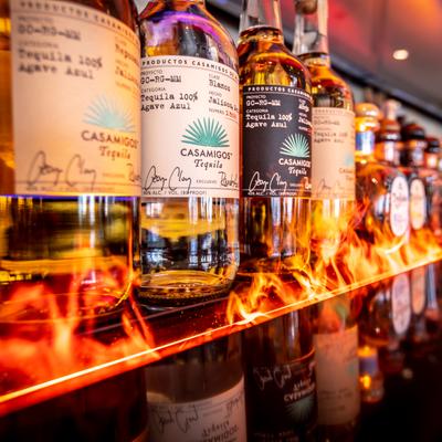 Various liquor bottles on the shelf.