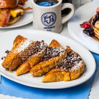 Crunchy French Toast topped with chocolate chips and powdered sugar.