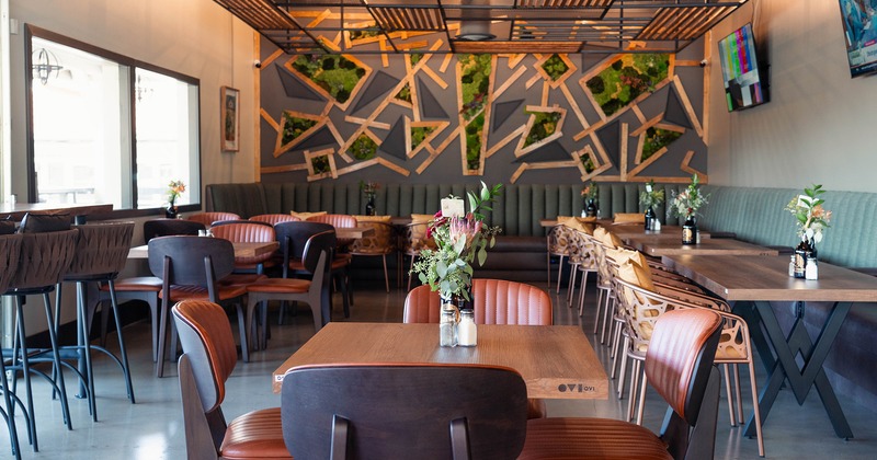 Interior space, cozy dining area, flower decorations on the tables