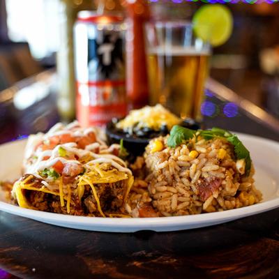Nachos with mixed vegetables, cheddar cheese, mayo and fried rice