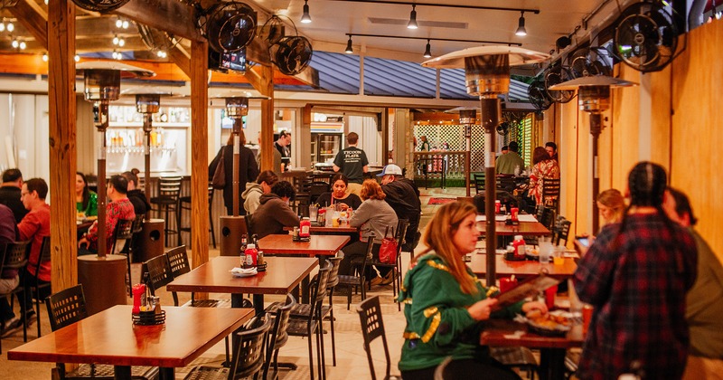 Interior, dining area, guests chatting and enjoying their food and drinks