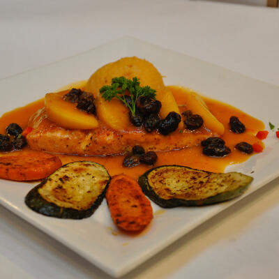 Grilled fish with sauce and vegetables