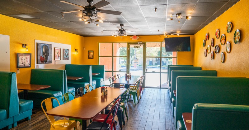 Interior, lined up benches, tables and chairs