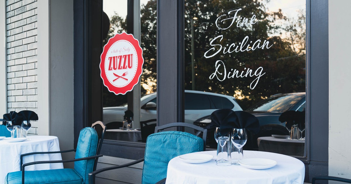 Exterior, round table and chair in front of the restaurant