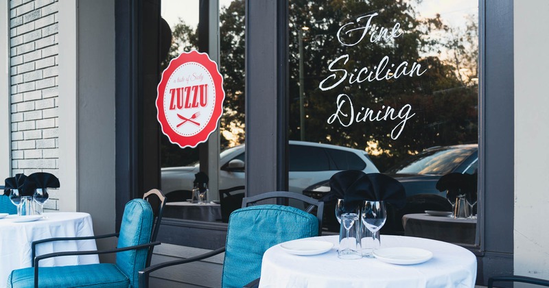 Exterior, round table and chair in front of the restaurant