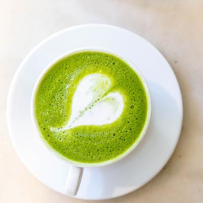 Matcha latte with heart foam art.