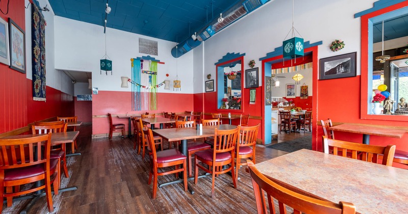 Interior, wooden tables and chairs ready for guests