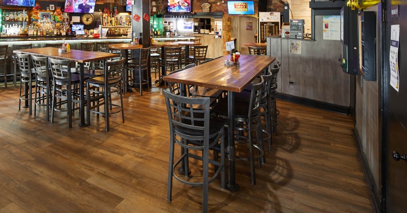 Interior, tall tables and bar chairs in the bar area