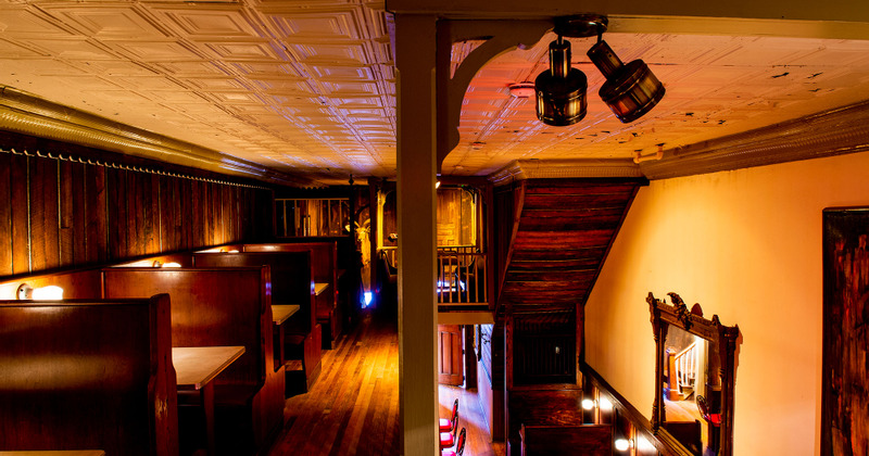 Interior,  vintage ambiance at the seating area, a large wall TV set